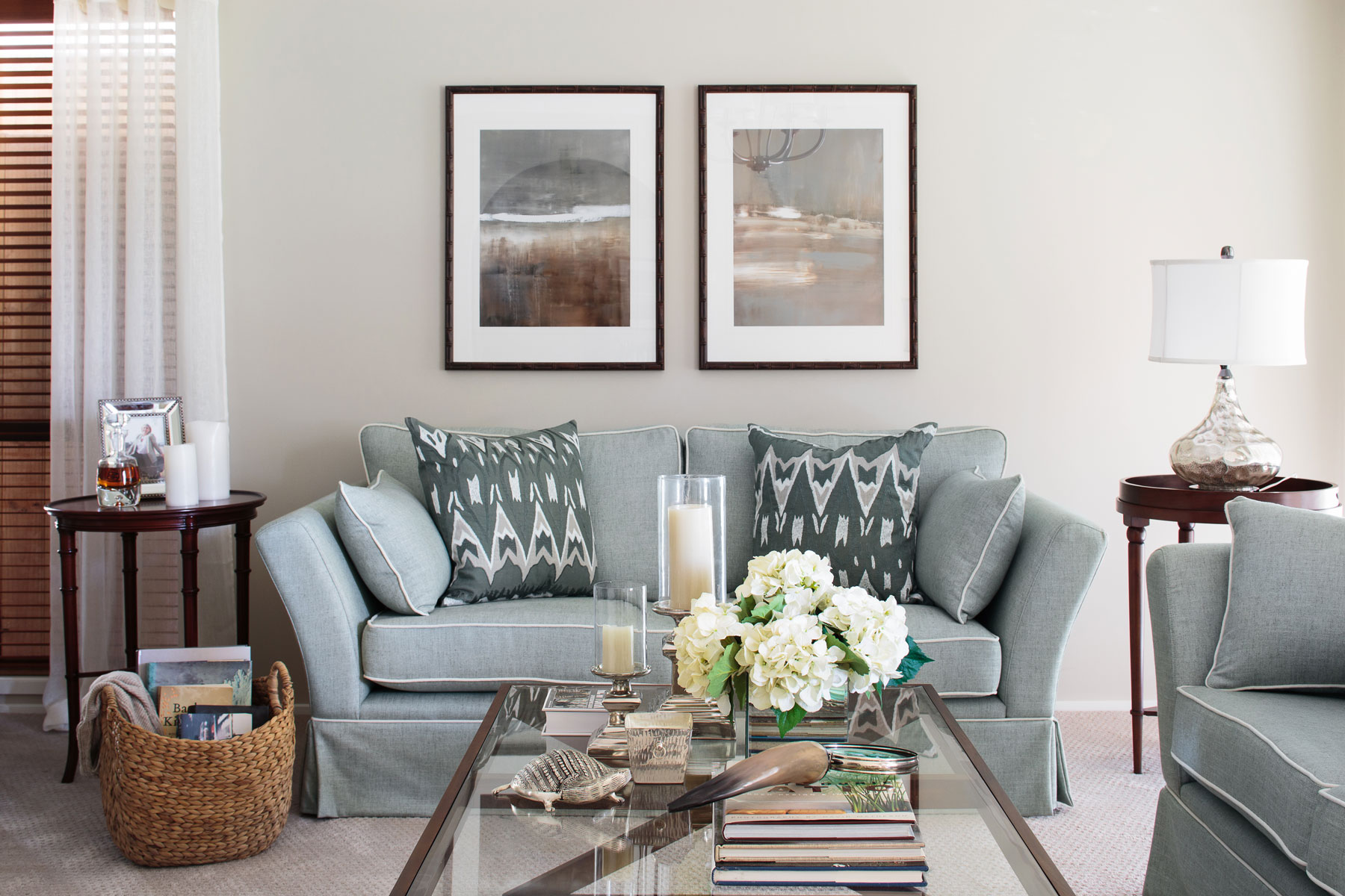 chisholm living room light blue sofa pillows white flowers cream rug classic interior designer